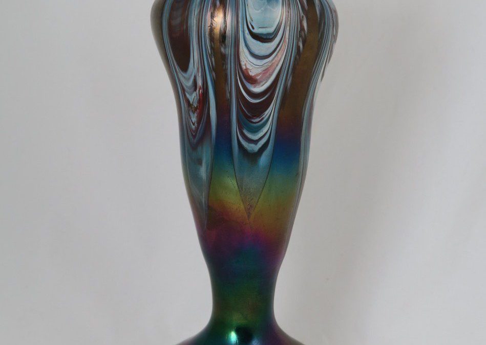 What is iridescent glass and why did it define the Art Nouveau era?
